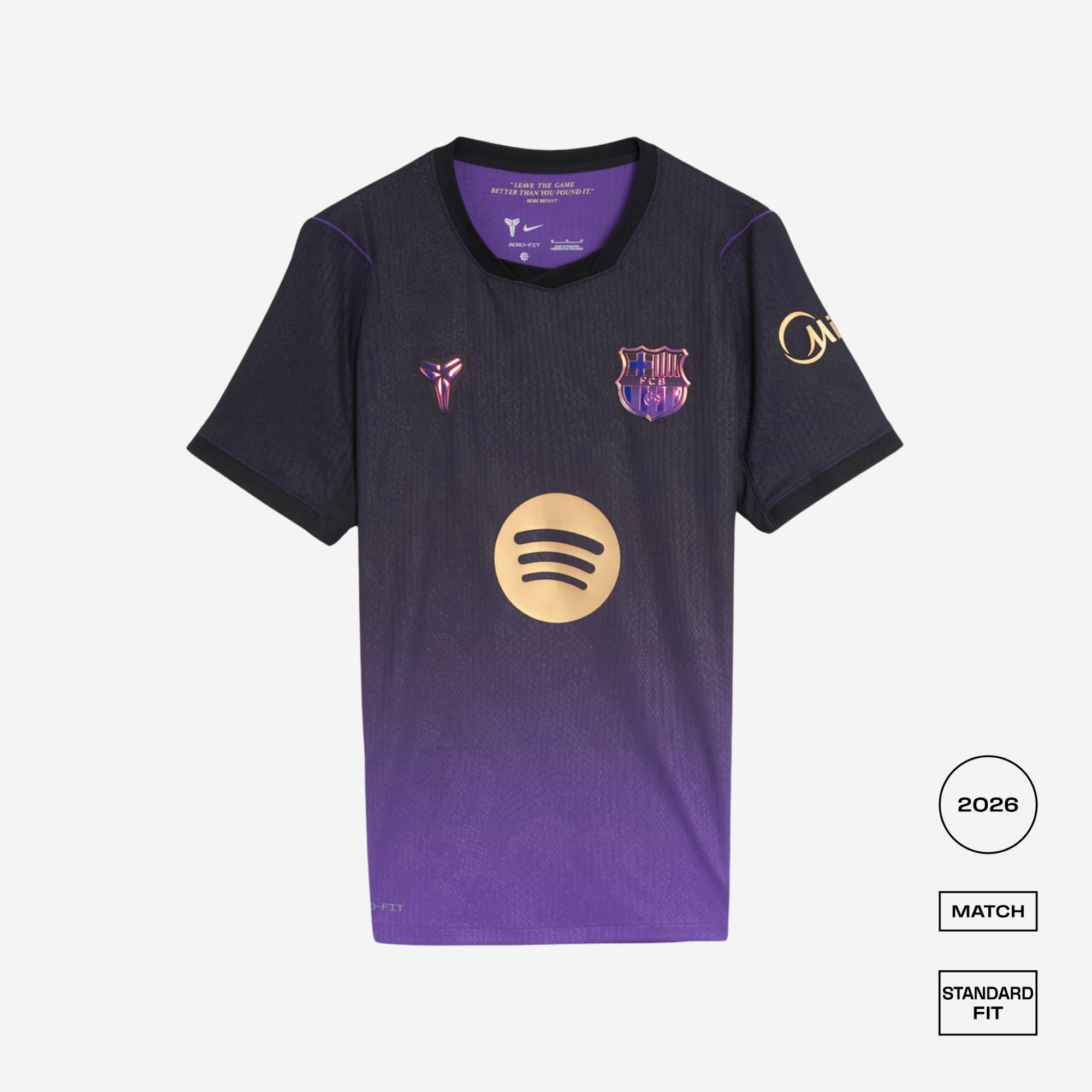 A short-sleeve soccer jersey displayed flat against a light gray background. The jersey features a dark navy-to-purple gradient, with the FC Barcelona crest on the left chest, a pinkish-purple Puskékó-style crest on the right chest, and a gold Spotify logo on the center front.