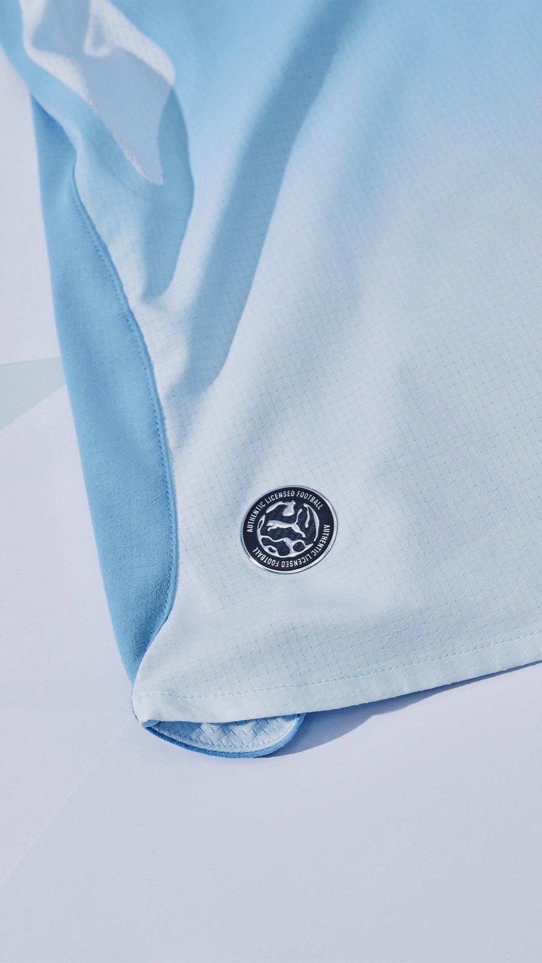 Light blue fabric with a logo on a light gray background