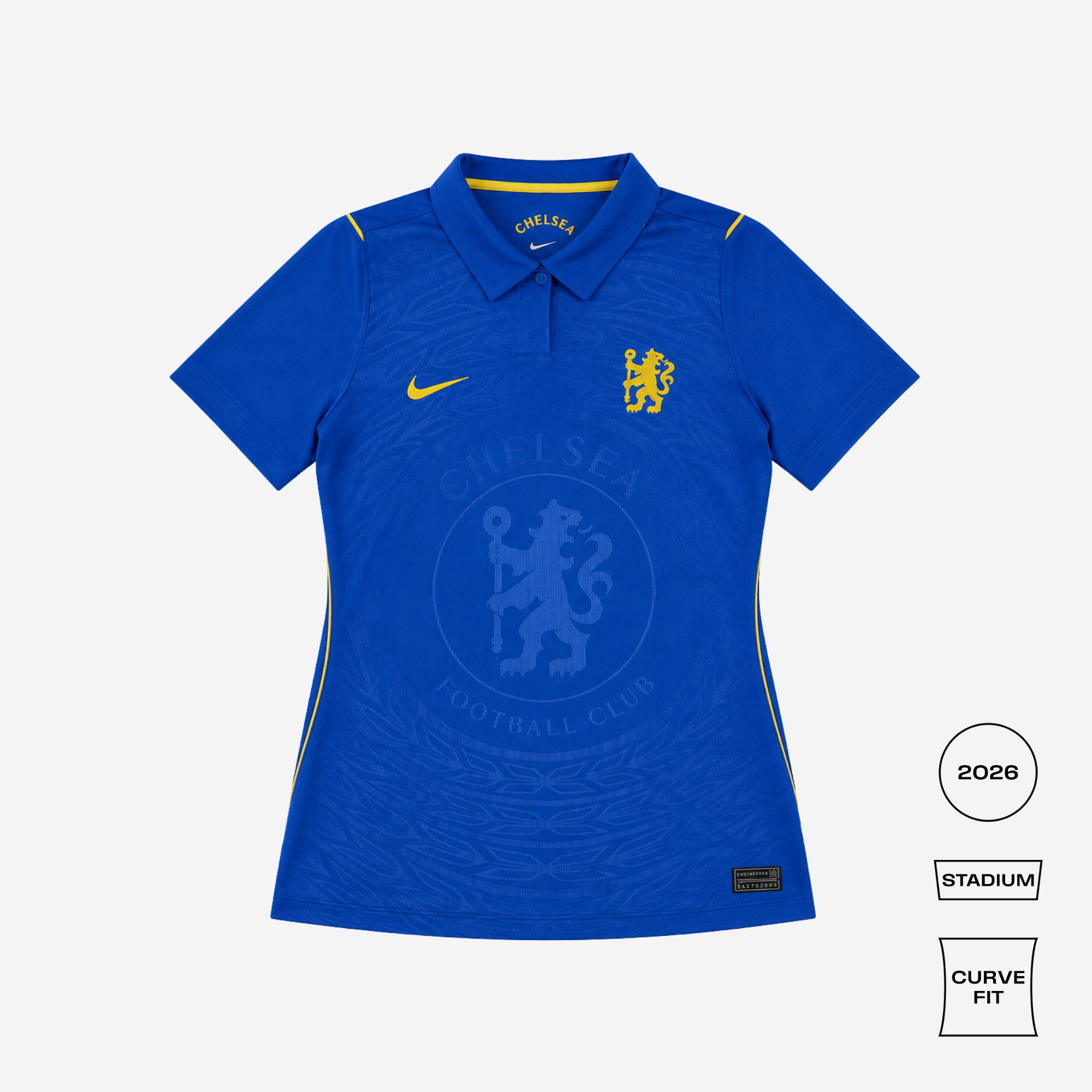 A blue Chelsea Football Club short-sleeve polo shirt with yellow accents, featuring the Nike swoosh, club crest, and a subtle tonal pattern. The image includes fit and year callouts on the right side.